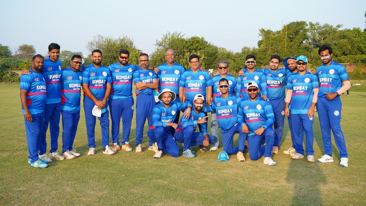 A team in blue kit lined up on a green ground